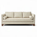 Hedendaagse bank in lichtbeige stof met houten poten 200 x 90 x 85cm